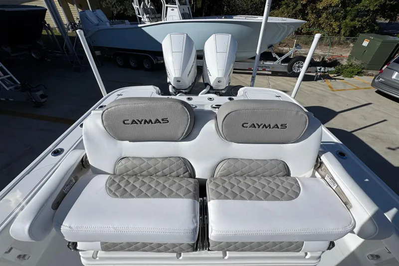 Slide: The Image of 2026 Caymas 281 HB boat with dual engines and cushioned seating. - 30