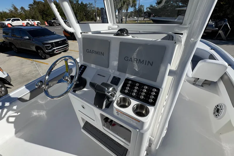 Slide: The Image of 2026 Caymas 281 HB boat dashboard with Garmin displays and steering wheel. - 35