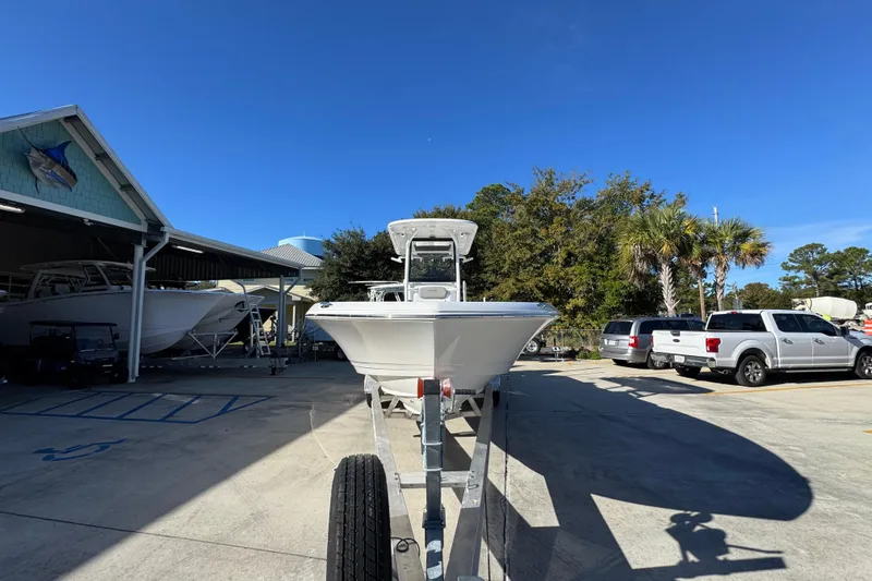 Slide: The Image of 2026 Caymas 281 HB boat on trailer in sunny outdoor setting. - 7