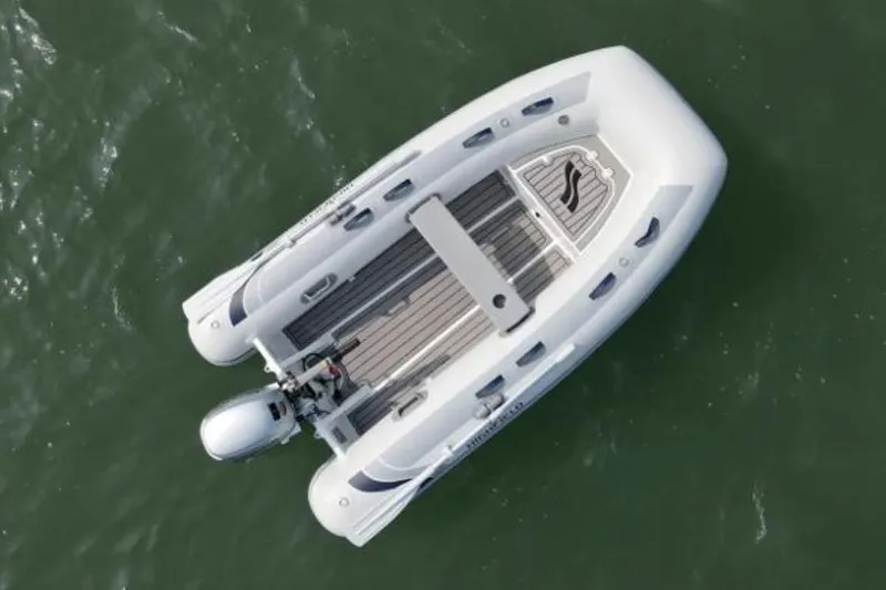 Slide: The Image of Aerial view of Highfield Classic 290 boat, 2026 model, on water. - 8