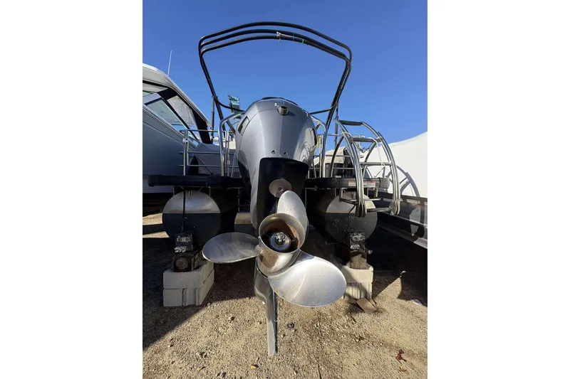 Slide: The Image of 2020 Godfrey Monaco 25 boat rear view with propeller and pontoons. - 16