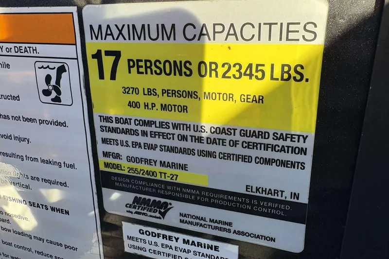 Slide: The Image of Maximum capacity label for Godfrey Monaco 25 boat, 2020 model, 17 persons or 2345 lbs. - 19