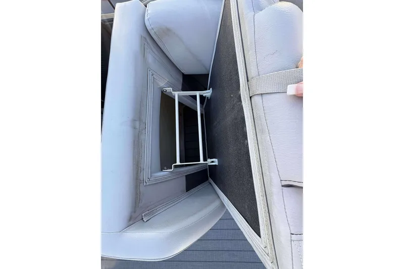 Slide: The Image of Open storage compartment in 2020 Godfrey Monaco 25 boat seat. - 8