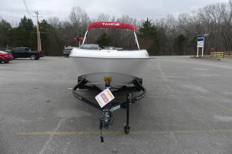 Slide: The Image of 2024 Tahoe T18 boat on trailer in parking lot, overcast day. - 3