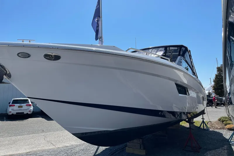 Slide: The Image of 2021 Cruisers Yachts 338 Outboard boat displayed outdoors on a sunny day. - 3