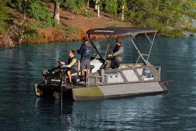 Slide: The Image of Manufacturer Provided Image: 2026 Sea-Doo Switch Fish 21 pontoon boat with anglers on a serene lake. - 4