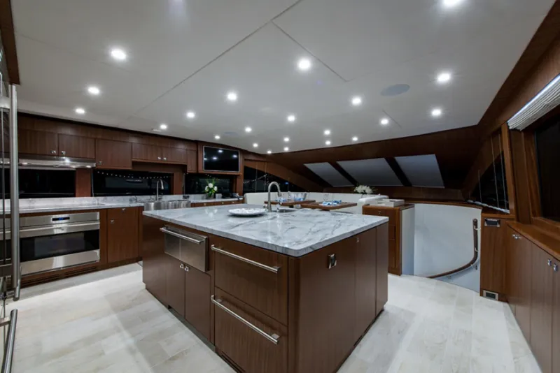 Slide: The Image of Luxurious kitchen interior of 2020 Hargrave G120 yacht with marble countertops and modern appliances. - 11