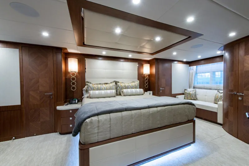 Slide: The Image of Luxurious master bedroom on a 2020 Hargrave G120 yacht with modern decor. - 18