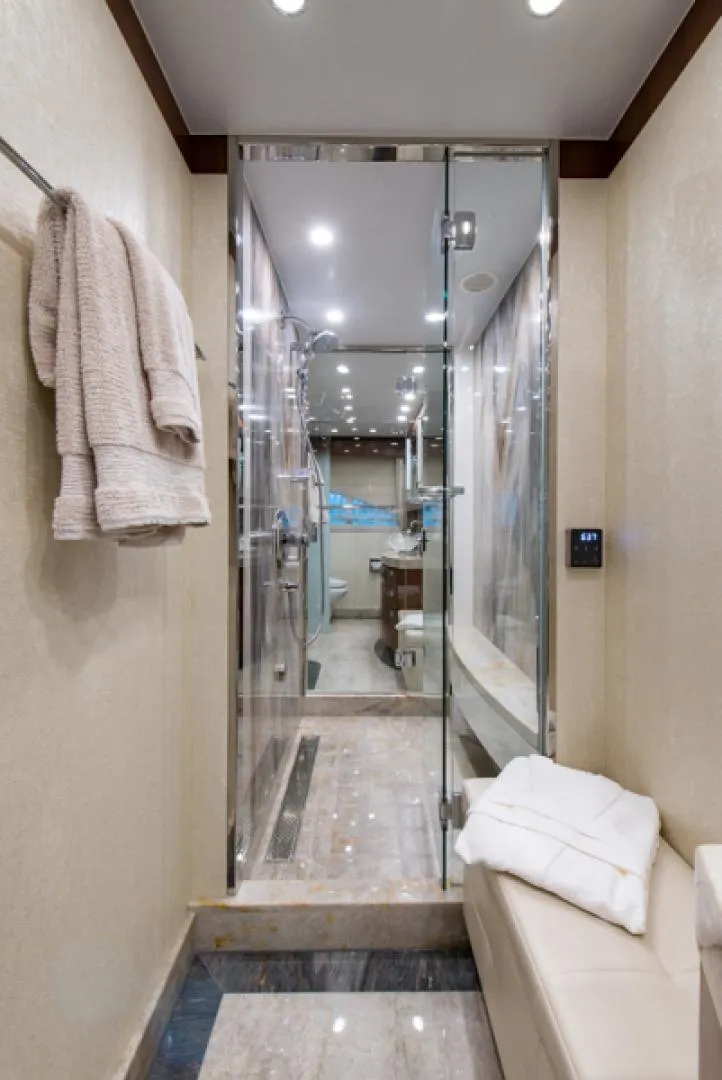 Slide: The Image of Luxurious bathroom in a 2020 Hargrave G120 yacht with glass shower and modern fixtures. - 28