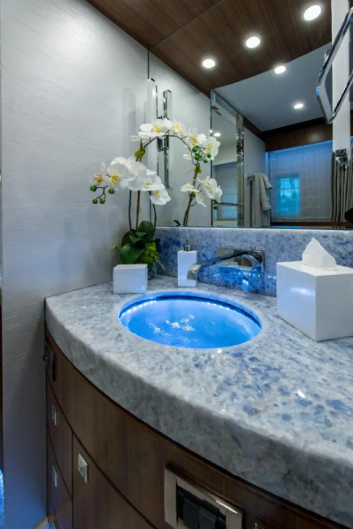 Slide: The Image of Luxurious bathroom in 2020 Hargrave G120 yacht with modern fixtures and blue-lit sink. - 31