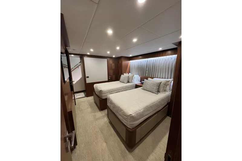 Slide: The Image of Luxurious twin bedroom in 2020 Hargrave G120 yacht, featuring elegant wood paneling and soft lighting. - 33