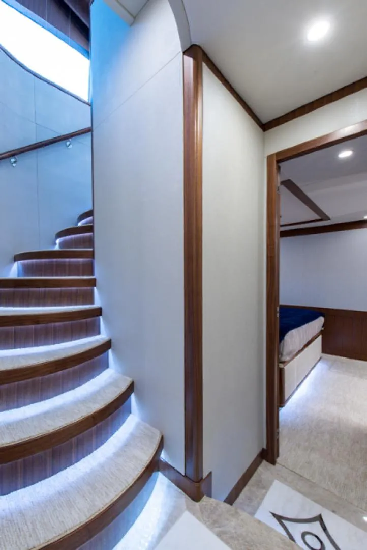 Slide: The Image of Interior of 2020 Hargrave G120 yacht with curved staircase and bedroom. - 36