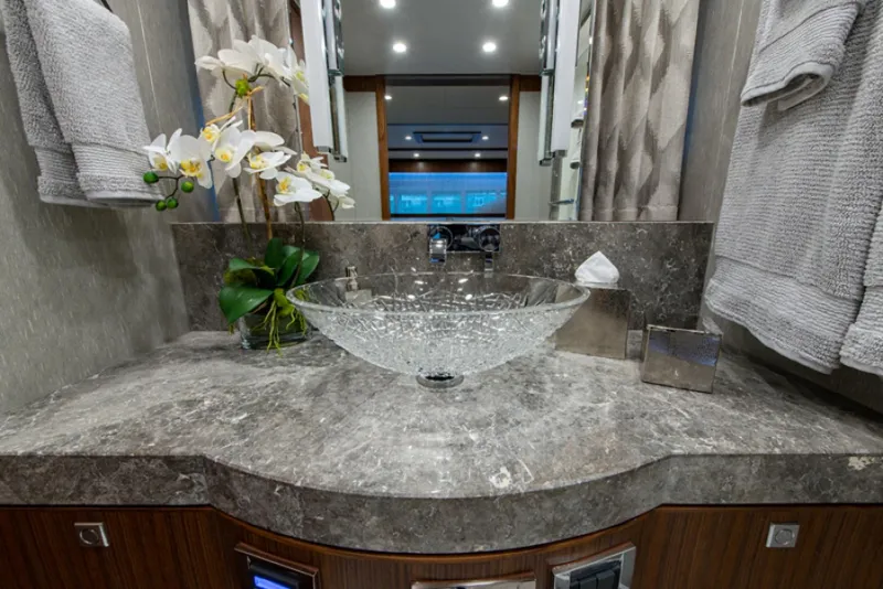 Slide: The Image of Luxurious bathroom vanity in 2020 Hargrave G120 yacht with glass sink and marble countertop. - 41