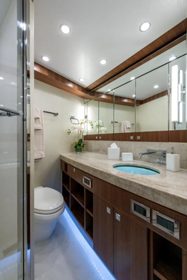 Slide: The Image of Luxurious bathroom in a 2020 Hargrave G120 yacht with modern fixtures and ambient lighting. - 45