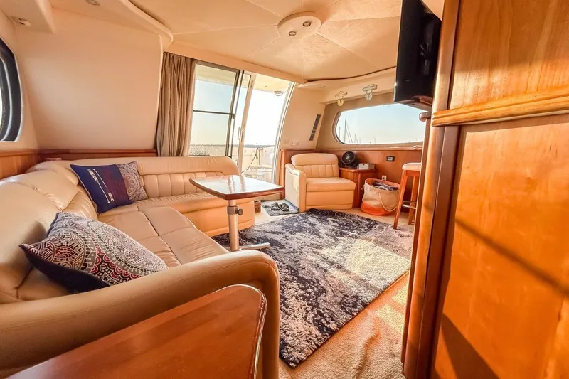 Slide: The Image of Luxurious interior of a 2003 Silverton 410 Sport Bridge yacht with plush seating and elegant decor. - 108