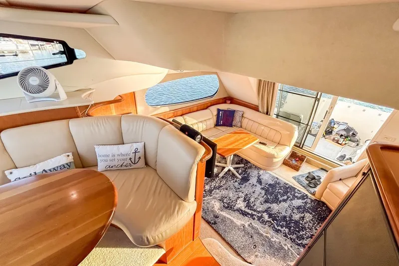 Slide: The Image of Luxurious interior of a 2003 Silverton 410 Sport Bridge yacht with elegant seating and decor. - 110
