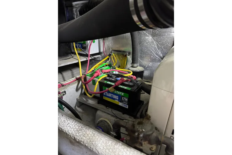 Slide: The Image of Engine compartment of a 2003 Silverton 410 Sport Bridge with battery and wiring. - 133