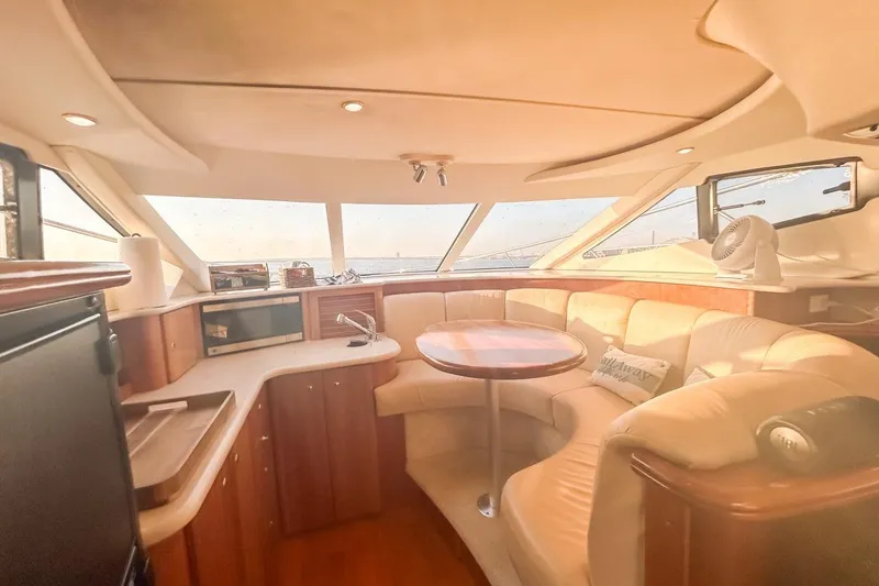 Slide: The Image of Luxurious interior of 2003 Silverton 410 Sport Bridge yacht with plush seating and modern amenities. - 84