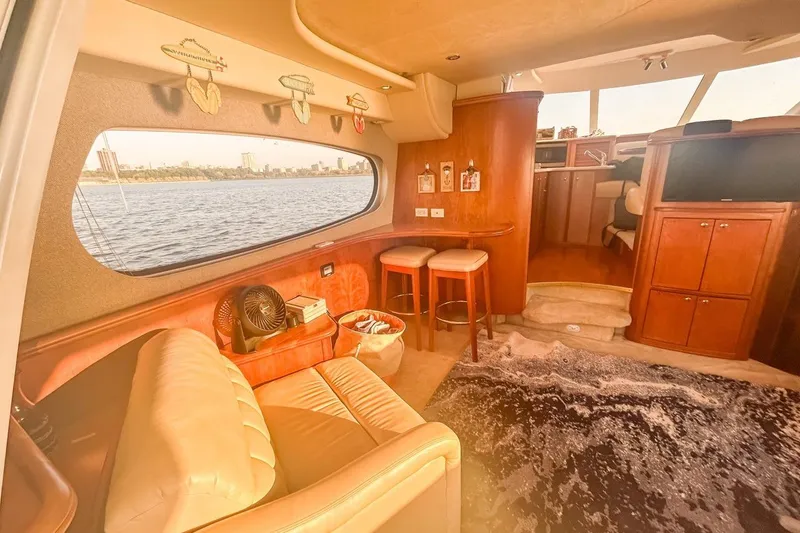 Slide: The Image of Luxurious interior of a 2003 Silverton 410 Sport Bridge yacht with waterfront view. - 86