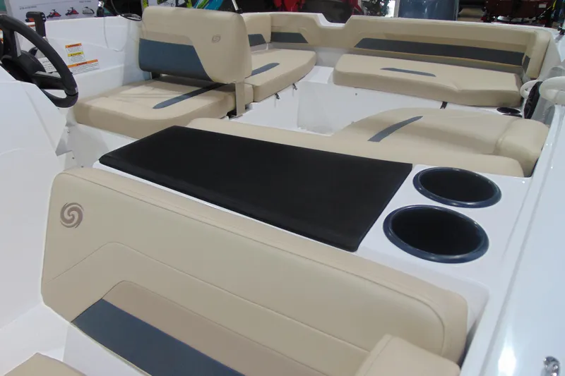 Slide: The Image of 2026 Hurricane SunDeck Sport 185 OB boat interior with beige seating and cup holders. - 17
