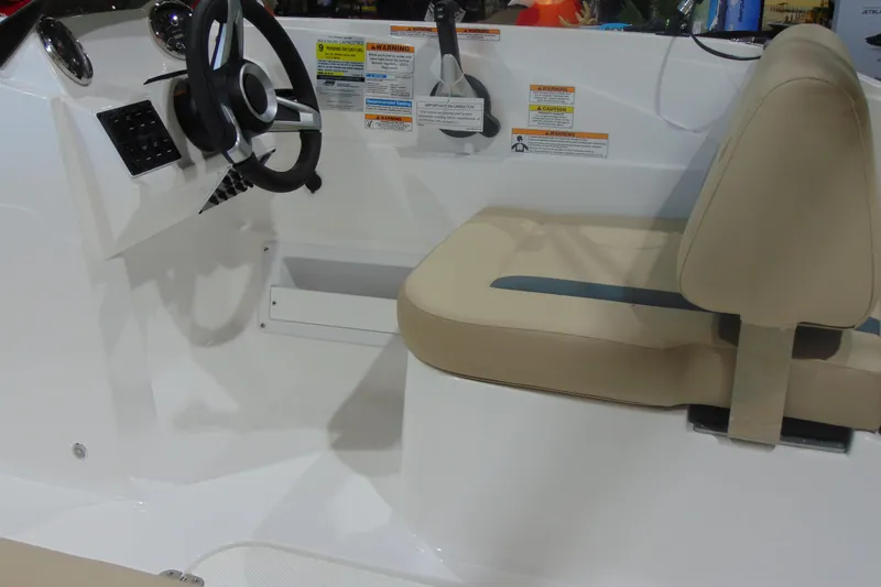 Slide: The Image of Interior of 2026 Hurricane SunDeck Sport 185 OB boat with steering wheel and seating. - 20