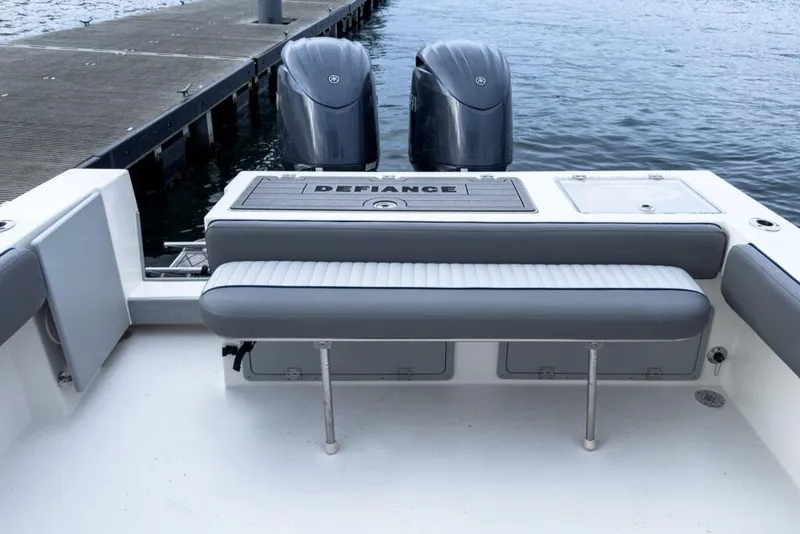 Slide: The Image of Manufacturer Provided Image: 2025 Defiance Admiral 260 EX boat with dual engines at dockside. - 6