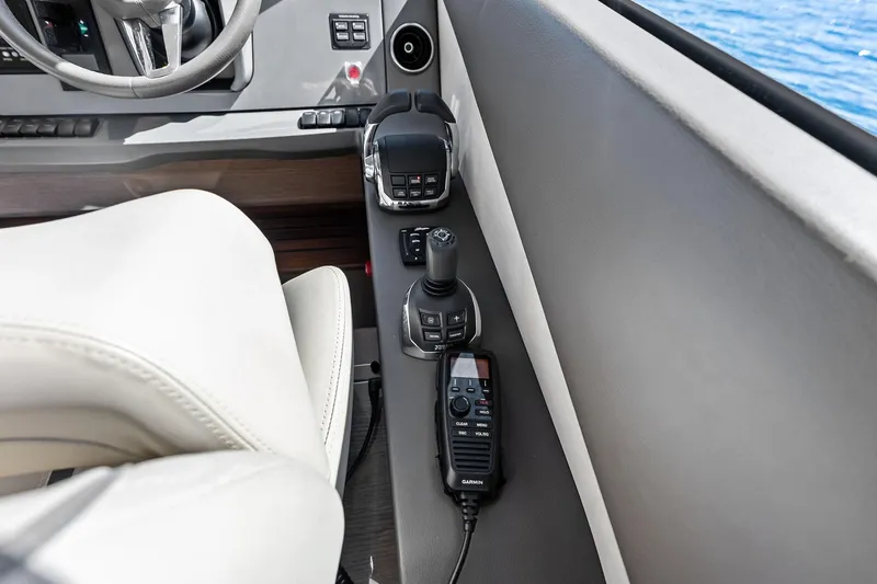 Slide: The Image of Control panel of 2022 Princess 55 Flybridge yacht with joystick and radio. - 10