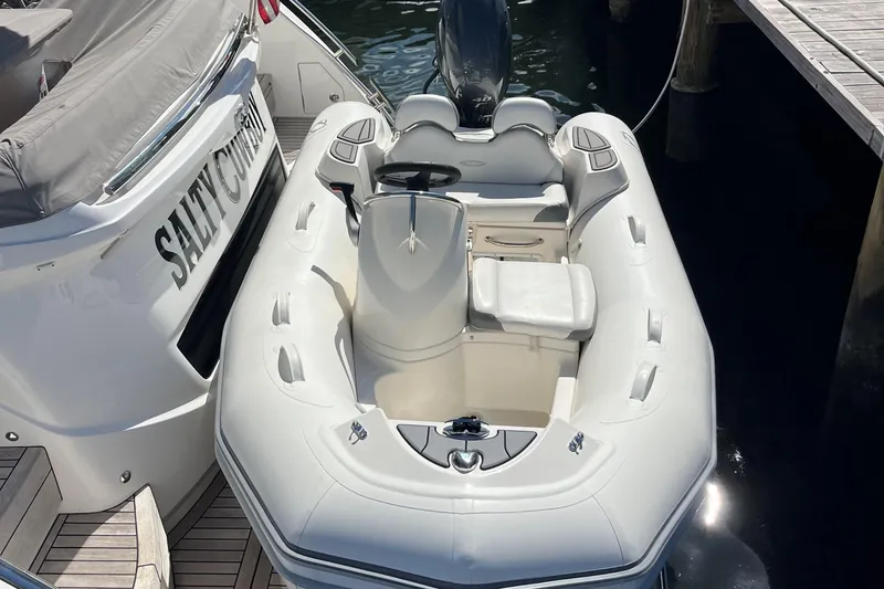 Slide: The Image of 2022 Princess F55 yacht with inflatable tender docked at marina. - 108