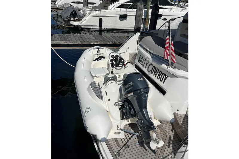 Slide: The Image of Luxury yacht "Salty Cowboy" docked, featuring a Yamaha outboard motor, Princess F55 model, 2022. - 109