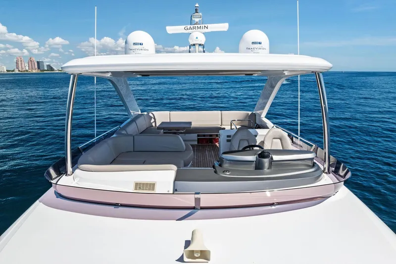 Slide: The Image of 2022 Princess 55 Flybridge yacht on open sea, featuring spacious seating and modern design. - 18
