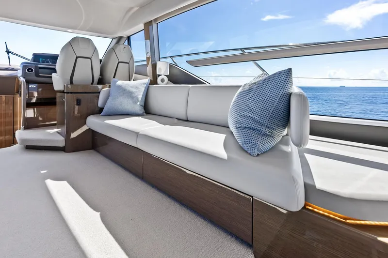 Slide: The Image of Luxurious interior of 2022 Princess 55 Flybridge yacht with elegant seating and ocean view. - 19