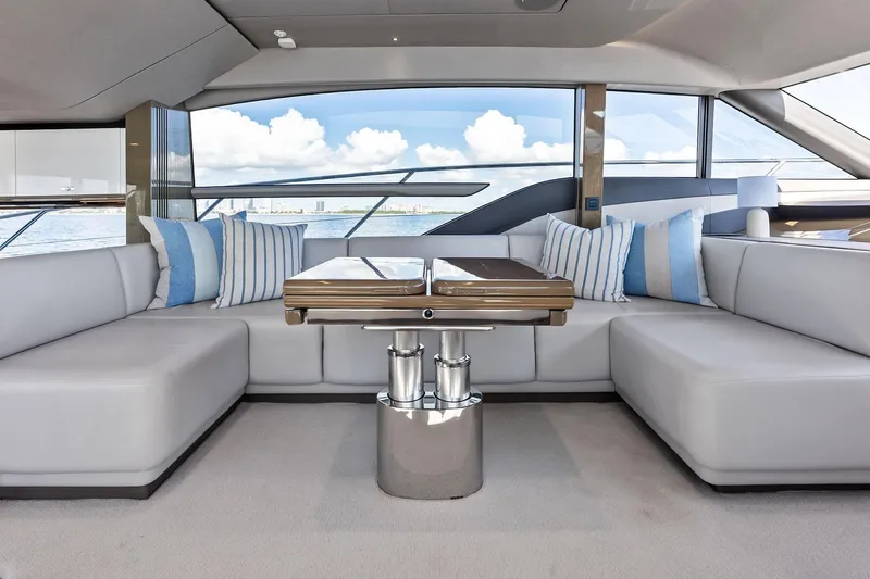 Slide: The Image of Luxurious interior of 2022 Princess 55 Flybridge yacht with elegant seating and ocean view. - 20