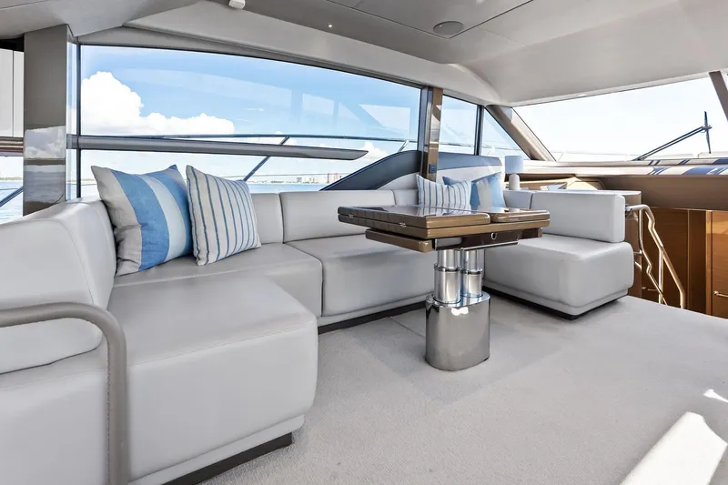 Slide: The Image of Luxurious interior of 2022 Princess 55 Flybridge yacht with modern seating and ocean view. - 22