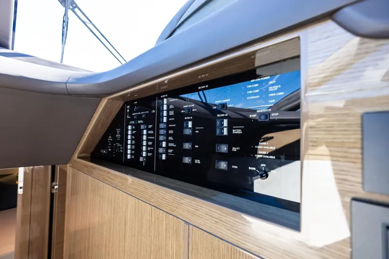 Slide: The Image of Control panel of 2022 Princess 55 Flybridge yacht, featuring modern navigation and system controls. - 27