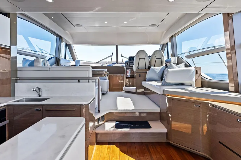 Slide: The Image of Luxurious interior of 2022 Princess 55 Flybridge yacht with modern design and panoramic windows. - 3