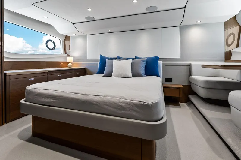 Slide: The Image of Luxurious bedroom interior of 2022 Princess 55 Flybridge yacht with modern design and ocean view. - 38