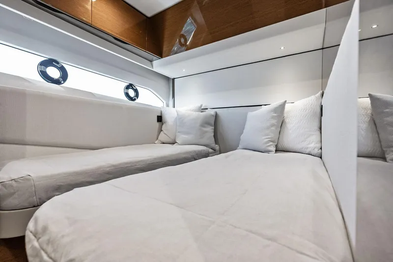 Slide: The Image of Luxurious interior of 2022 Princess 55 Flybridge yacht with elegant bedding and modern design. - 39