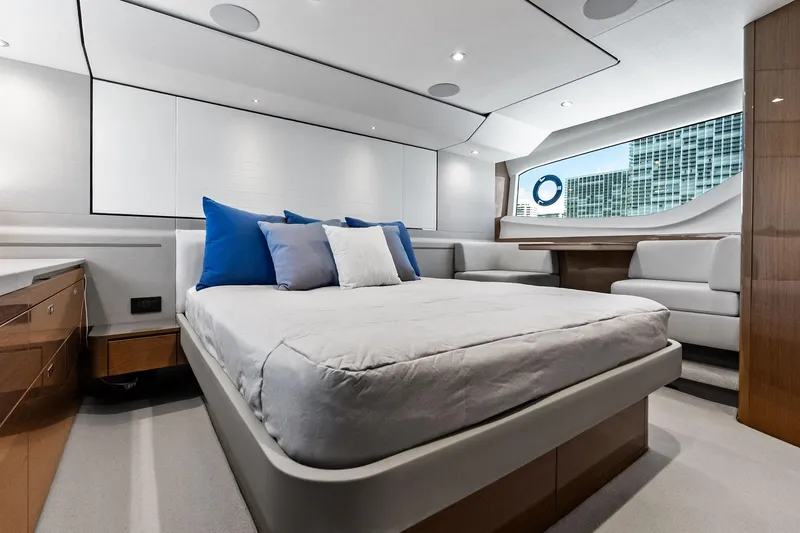 Slide: The Image of Luxurious bedroom interior of 2022 Princess 55 Flybridge yacht with modern design and large window. - 4