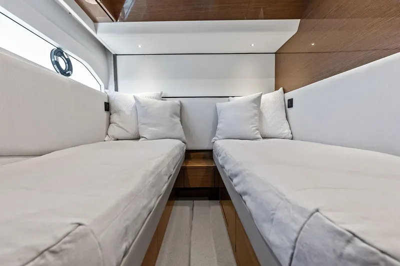 Slide: The Image of Luxurious interior of 2022 Princess 55 Flybridge yacht with twin beds and elegant decor. - 40
