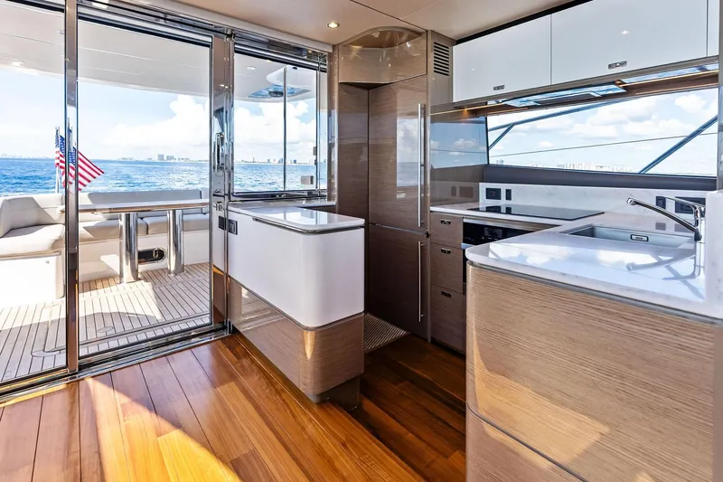Slide: The Image of Luxurious 2022 Princess 55 Flybridge yacht interior with modern kitchen and ocean view. - 46