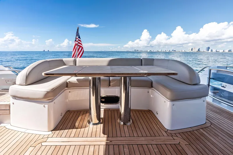 Slide: The Image of Luxurious 2022 Princess 55 flybridge yacht with elegant seating and ocean view. - 5