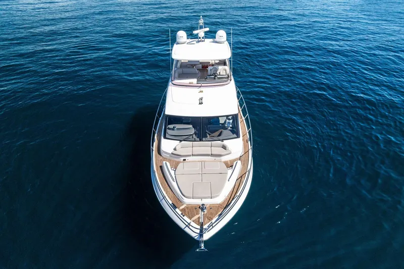 Slide: The Image of 2022 Princess 55 Flybridge yacht on open water, aerial view. - 54