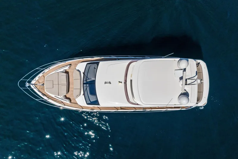Slide: The Image of Aerial view of 2022 Princess 55 Flybridge yacht on calm blue water. - 56