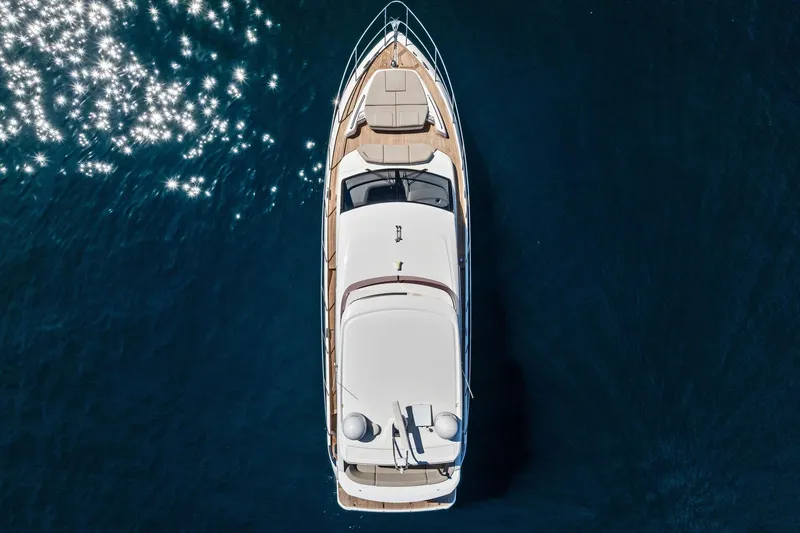 Slide: The Image of Aerial view of 2022 Princess 55 Flybridge yacht on sparkling blue water. - 57