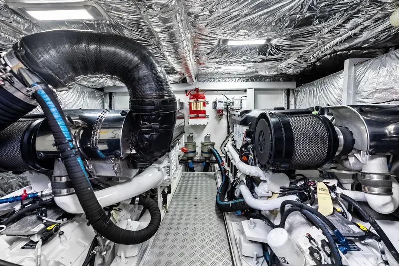 Slide: The Image of Engine room of 2022 Princess 55 Flybridge yacht, featuring advanced machinery and insulation. - 65
