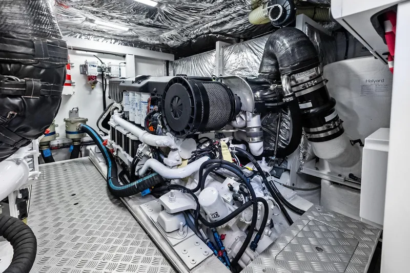 Slide: The Image of Engine room of 2022 Princess 55 Flybridge yacht, showcasing advanced machinery and components. - 66