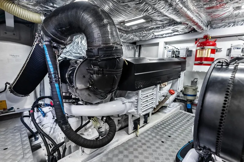 Slide: The Image of Engine room of 2022 Princess 55 Flybridge yacht, featuring advanced machinery and fire safety equipment. - 67