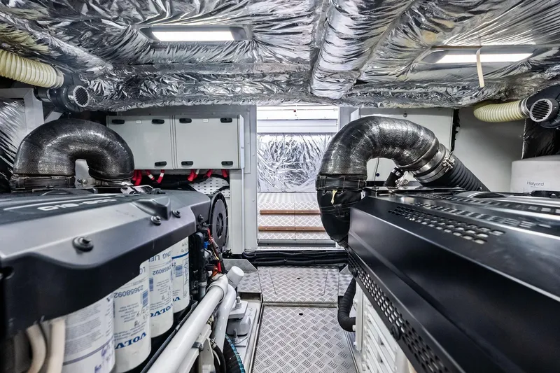 Slide: The Image of Engine room of 2022 Princess 55 Flybridge yacht, featuring advanced machinery and insulation. - 69