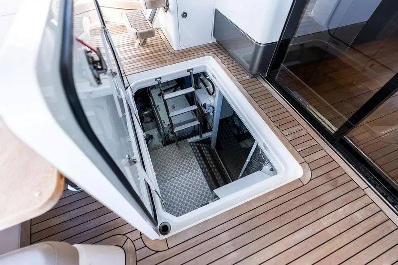 Slide: The Image of Engine room access on 2022 Princess 55 Flybridge yacht with teak flooring. - 72