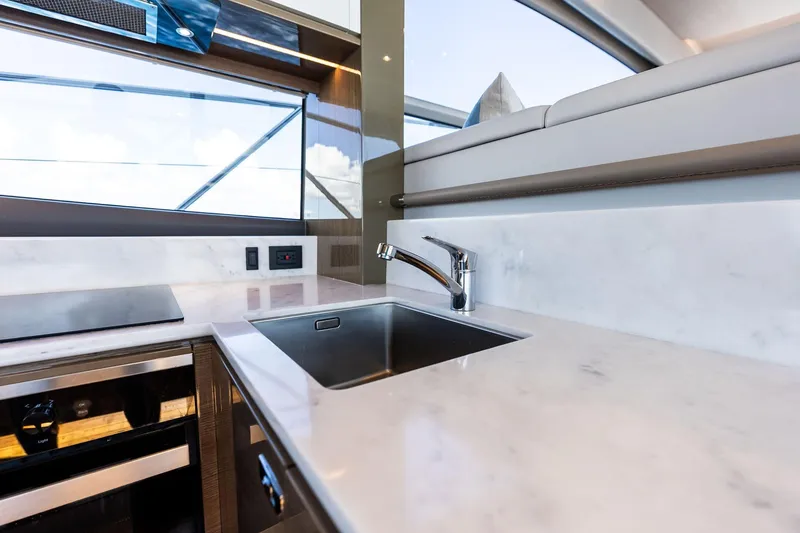 Slide: The Image of Modern kitchen area on 2022 Princess 55 flybridge yacht with sleek design. - 77